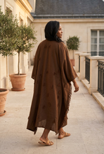 Load image into Gallery viewer, Brown bubu rear-view lifestyle image on a terrace