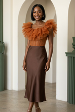Load image into Gallery viewer, Cherise styled with a satin midi skirt
